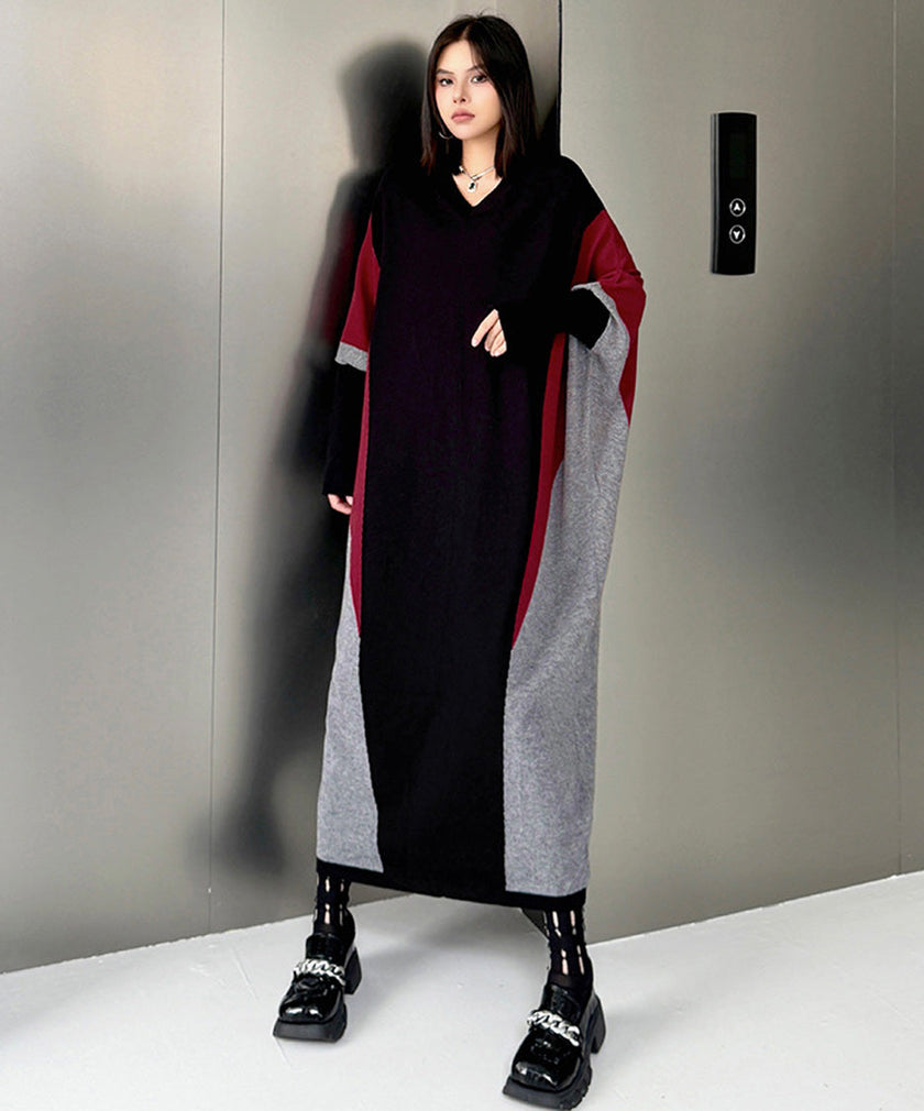 FJØRNA white panel knit long dress displayed on a model, featuring a fitted silhouette and stylish long sleeves.