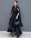 White Veil Flow Dress by FJØRNA, featuring lightweight fabric and flowing design, displayed on a hanger.