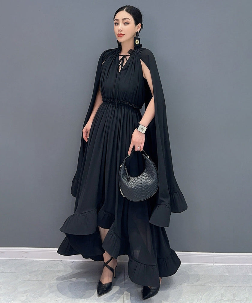 White Veil Flow Dress by FJØRNA, featuring lightweight fabric and flowing design, displayed on a hanger.