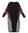 FJØRNA Panel Knit Long Dress in white, featuring a flowing knit design and long sleeves, styled for elegant comfort.