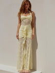 FJØRNA lace maxi dress featuring intricate lace details, long flowing silhouette, and elegant design for formal occasions.