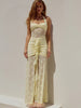 FJØRNA lace maxi dress featuring intricate lace details, long flowing silhouette, and elegant design for formal occasions.