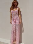 FJØRNA lace maxi dress featuring intricate lace fabric, floor-length design, and elegant silhouette for formal occasions.