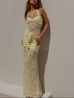 FJØRNA lace maxi dress with intricate lace details and flowing silhouette, perfect for elegant occasions.
