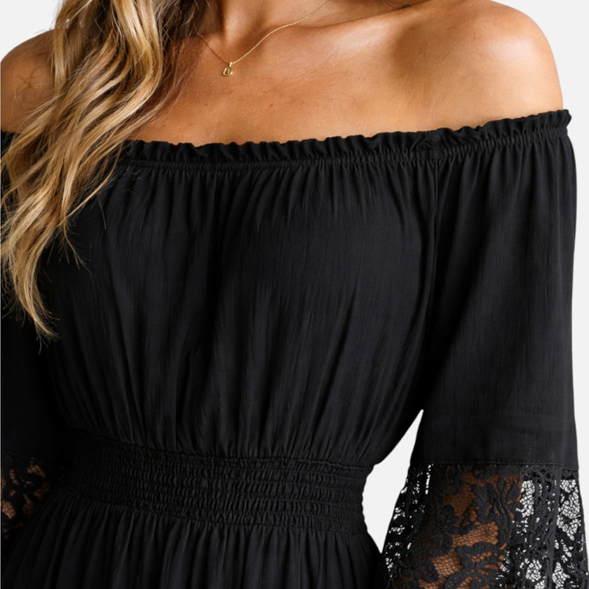 Women's off-shoulder lace maxi dress by FJØRNA, elegant summer dress with flowing fabric and stylish design.
