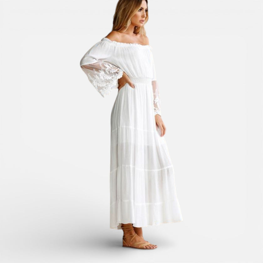 Women's off-shoulder lace maxi dress by FJØRNA, elegant summer dress with flowing fabric and stylish shoulder design.
