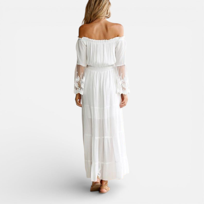 Women's off-shoulder lace maxi dress by FJØRNA, elegant summer dress with flowing fabric and stylish design.