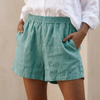 Lake blue women's summer shorts by FJØRNA with linen fabric, high waist, pockets, and a relaxed fit for casual wear.