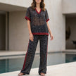 FJØRNA leopard print chiffon lounge set with relaxed fit, includes a wide-leg pants and matching top, cozy and stylish 2-piece ensemble.