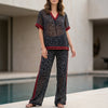 FJØRNA leopard print chiffon lounge set with relaxed fit, includes a wide-leg pants and matching top, cozy and stylish 2-piece ensemble.