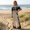 FJØRNA printed crop top and wide-leg pants matching set, casual lifestyle outfit with colorful patterns and relaxed fit.