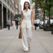 FJØRNA sleeveless high-neck two-piece set with flowing wide-leg trousers, styled in a modern, elegant outfit for women.