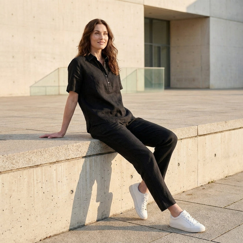 Women wearing FJØRNA summer short sleeve denim blouse, casual lifestyle shot showcasing the relaxed fit and stylish design.