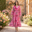 FJØRNA belted tiered A-line wrap maxi dress for women, featuring a flowy silhouette and stylish design in a lifestyle setting.