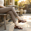 FJØRNA women's square toe block heel criss-cross sandals, stylish open-toe footwear worn outdoors with a casual outfit.