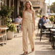 FJØRNA women's summer two-piece co-ord set with one-shoulder top and pocketed shorts, styled for a casual outdoor look.