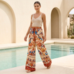 Women’s summer trousers by FJØRNA with cotton fabric, drawstring waist, and wide-leg style in a casual, relaxed fit.
