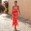 FJØRNA fitted one-shoulder mesh overlay maxi dress with ruched detail, styled in a chic evening look.