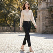 FJØRNA women's summer blouse with V-neck and puff sleeves, lightweight chiffon fabric, styled for a casual summer outfit