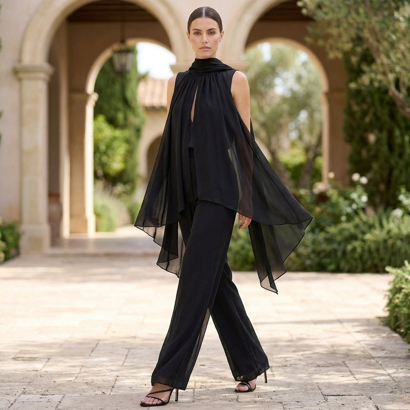 FJØRNA elegant two-piece chiffon pleated co-ord set for women, featuring a stylish top and matching skirt in a lifestyle setting.