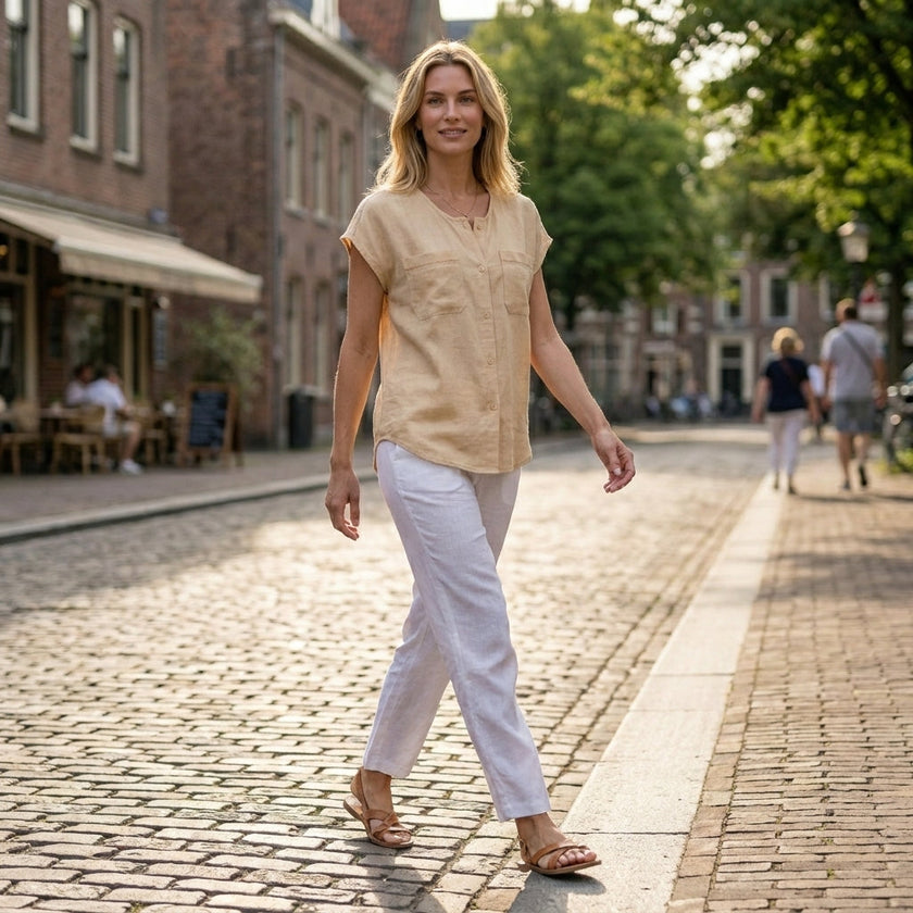 FJØRNA women's summer sleeveless V-neck blouse worn by a woman in a casual outdoor setting