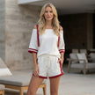 FJØRNA sporty contrast trim two-piece set with relaxed off-shoulder top, casual lifestyle image showing stylish activewear ensemble.