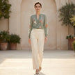 FJØRNA women's floral V-neck long sleeve summer blouse worn by a woman in a casual outdoor setting.