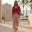 FJØRNA women's summer two-piece set with striped high waist shorts and matching crop top, casual lifestyle scene.