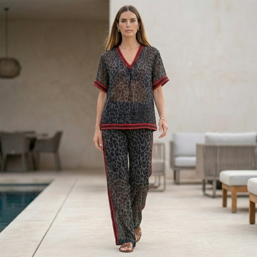 FJØRNA leopard print chiffon lounge set with relaxed wide-leg silhouette, featuring a two-piece design, styled in a casual home setting.