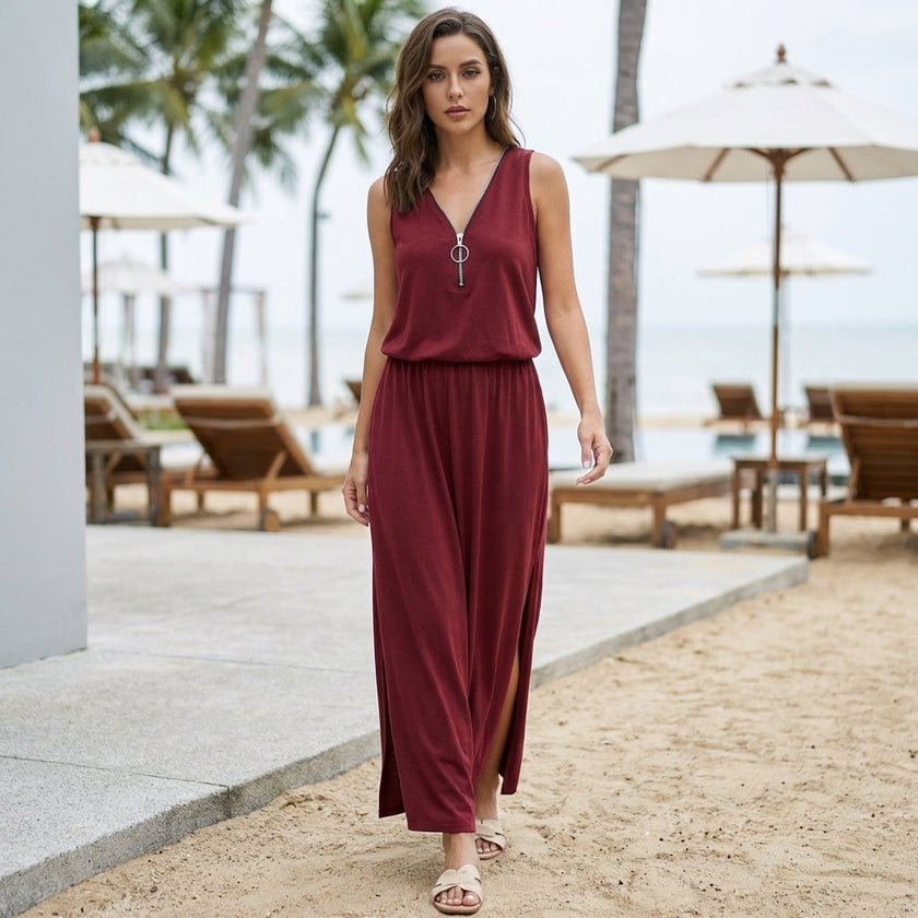 FJØRNA relaxed fit sleeveless V-neck maxi dress worn by a woman outdoors, flowing fabric and casual summer style.