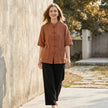 FJØRNA summer women's blouse with denim pockets, lightweight top perfect for warm weather, casual style, and relaxed fit.