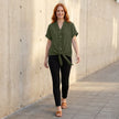 FJØRNA women's summer V-neck denim blouse with ruffle details, casual top ideal for warm weather and relaxed styles.