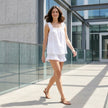 FJØRNA ruffle strap sleeveless top and shorts lounge set worn by a model in a casual indoor setting.