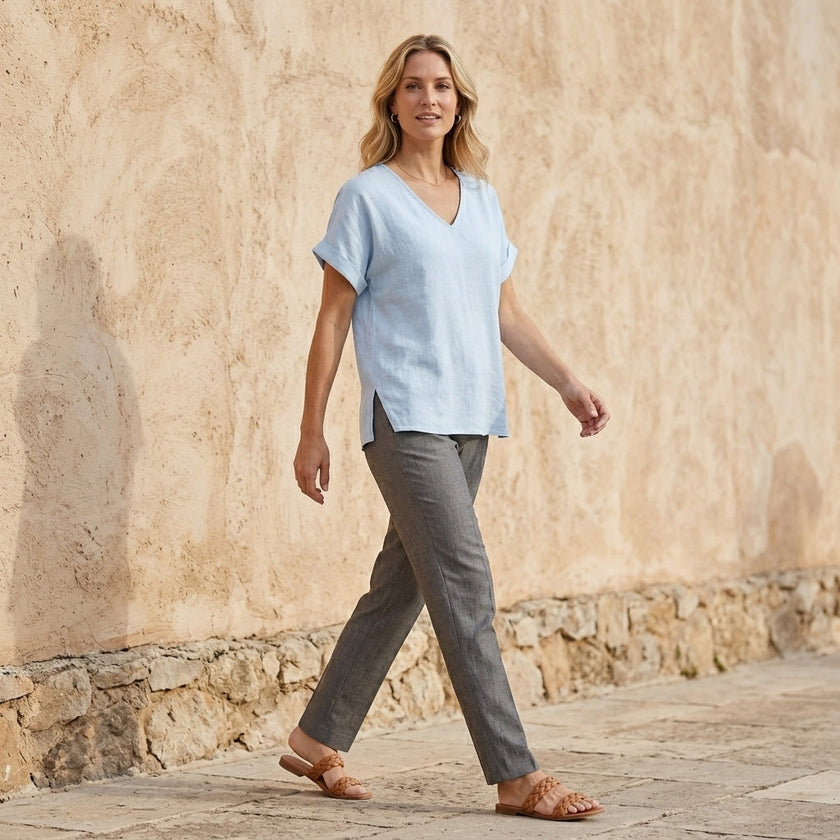 FJØRNA women's summer V-neck denim blouse with short sleeves, styled in a casual outdoor setting.