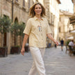 FJØRNA summer floral short sleeve denim blouse for women, casual top with a breezy, stylish design in a lifestyle setting.