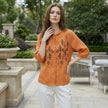 FJØRNA summer blouse for women featuring a geometric button front, stylish top perfect for casual and warm weather wear.