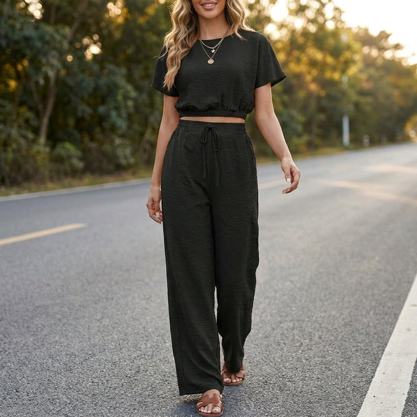FJØRNA Coastal Breeze textured two-piece lounge set with wide-leg pants, styled in a relaxed home environment.