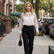 FJØRNA women's summer blouse with mesh fabric and button front, styled as a casual top in a lifestyle setting.
