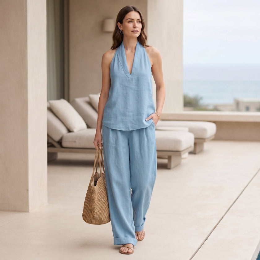 FJØRNA relaxed two-piece halter V-neck set with wide-leg pants worn by a model in a casual outdoor setting.