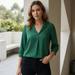 FJØRNA summer blouse for women with v-neck, puff sleeves, and high waist, shown styled casually in a lifestyle setting.