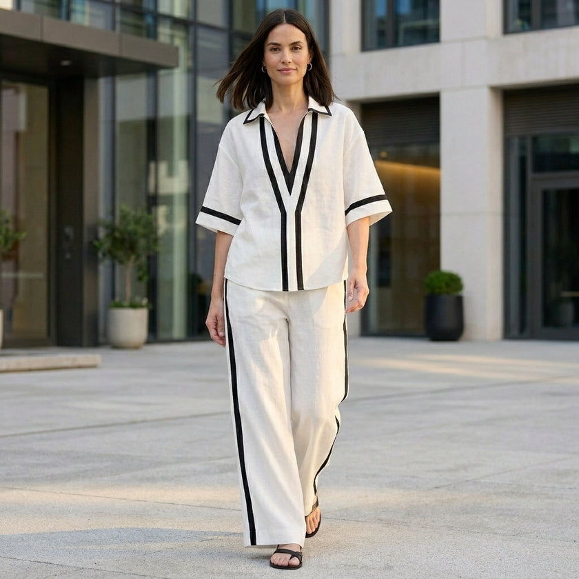 FJØRNA Coastal Chic contrast trim top and wide-leg pants set worn in a relaxed lifestyle setting, showcasing stylish casual wear.