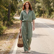 FJØRNA zip-neck top and wide-leg trouser set in a stylish, casual lifestyle scene, showcasing the comfortable, coordinated 2-piece outfit.