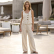 FJØRNA relaxed sleeveless two-piece set with decorative buttons and wide-leg trousers, casual lifestyle outfit.