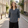 FJØRNA summer blouse for women, geometric long sleeve top worn outdoors, featuring a stylish pattern and lightweight fabric.
