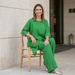 FJØRNA relaxed two-piece set with flowing wide-leg pants, casual and stylish lifestyle outfit in neutral fabric.
