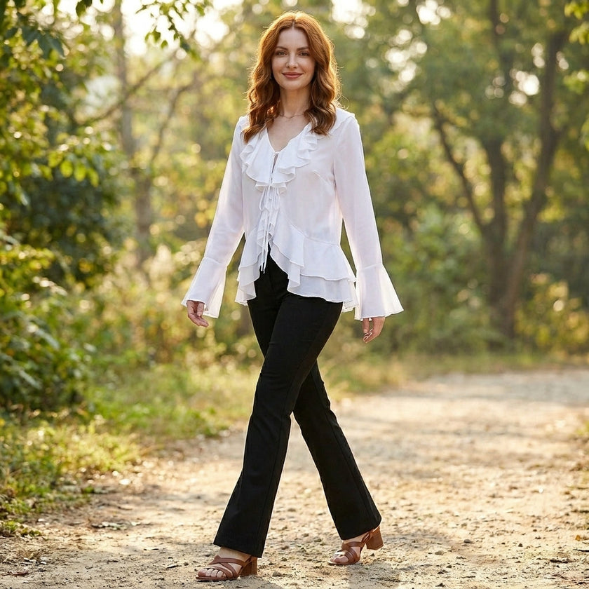 FJØRNA summer blouse for women with bell sleeves, denim fabric, casual top for warm weather, worn in a lifestyle setting