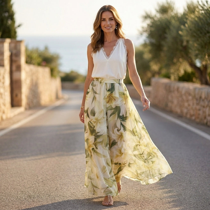 FJØRNA seaside halter top and flowing palazzo pants resort set, shown in a relaxed lifestyle setting with beach-inspired style.