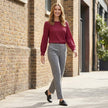 FJØRNA women's long sleeve denim summer blouse with pleated design, styled casually in a lifestyle setting.