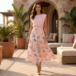 FJØRNA women's summer two-piece pleated co-ord set worn by a woman outdoors, featuring a stylish matching top and skirt.