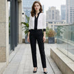 FJØRNA women's summer blouse featuring a V-neck and long chiffon sleeves, styled casually with a relaxed fit.